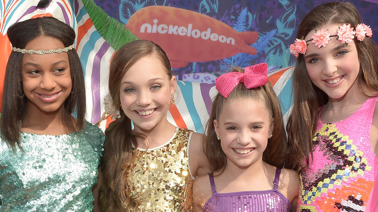 Dance Moms stars posing at event