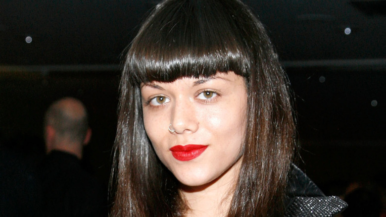 Maya Luz wearing red lipstick at an event