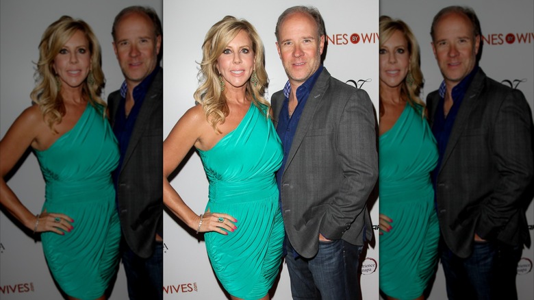 Brooks Ayers in blue shirt and gray blazer with Vicki Gunvaison in a teal dress