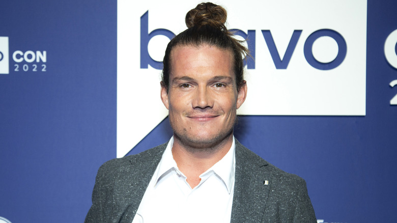 Gary King with man bun and tweed blazer at a Bravo event
