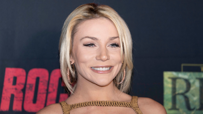 Courtney Stodden with short blonde bob and gold hoop earrings