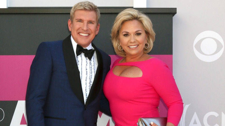 Todd Chrisley in tux and Julie Chrisley in pink gown at the 2017 ACM Awards