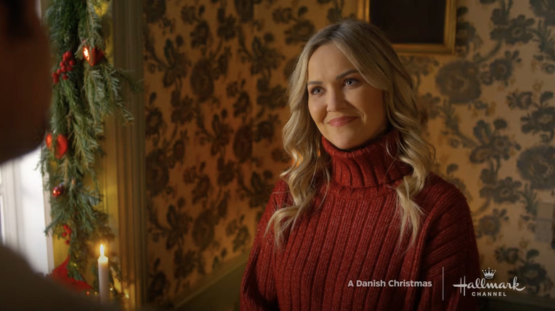 Emilie Ullerup smiling in a scene from A Danish Christmas.