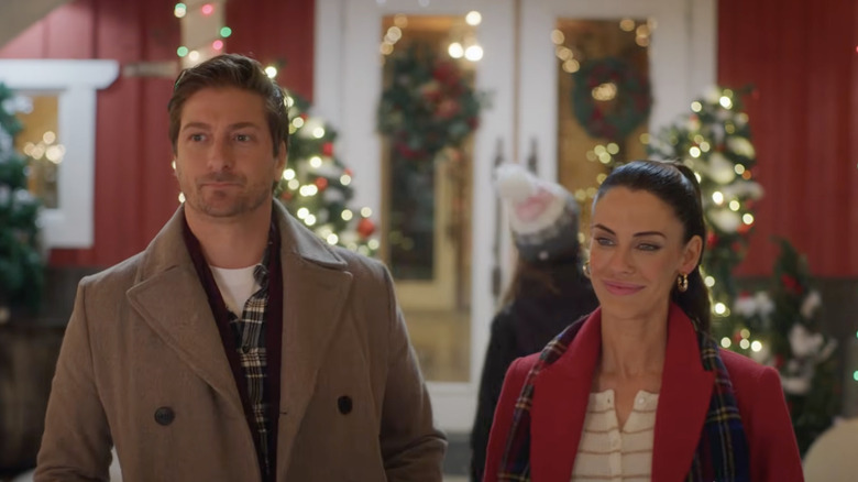 Daniel Lissing and Jessica Lowndes acting in Christmas Under Construction.