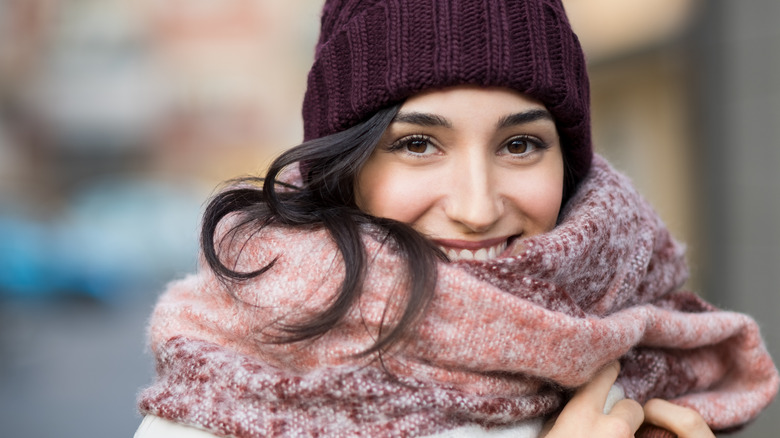 Woman wearing beanie and warm scarf