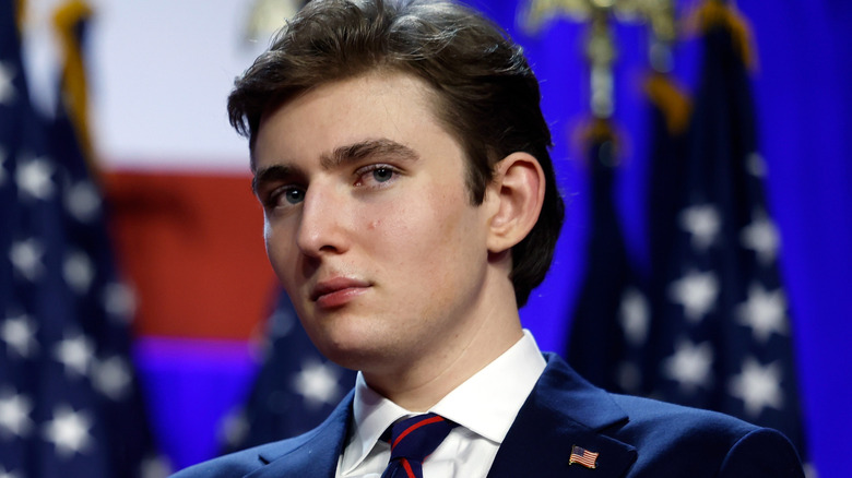 Barron Trump looks on as Donald Trump speaks during an election night event at the Palm Beach Convention Center on November 6, 2024 in West Palm Beach, Florida (2024)