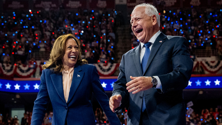 Kamala Harris and Tim Walz laughing onstage together