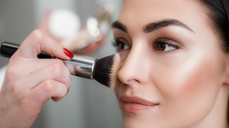 Woman having her makeup done 