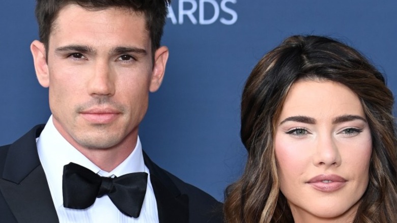 Tanner Novlan and Jacqueline MacInnes Wood posing on the red carpet