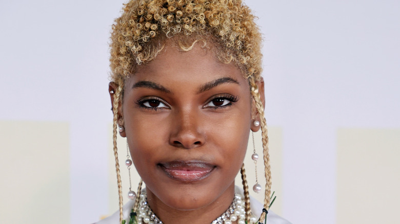 Diamond White smirking