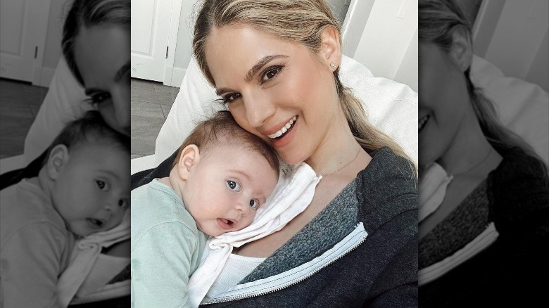 Kelly Kruger smiling with baby Gemma