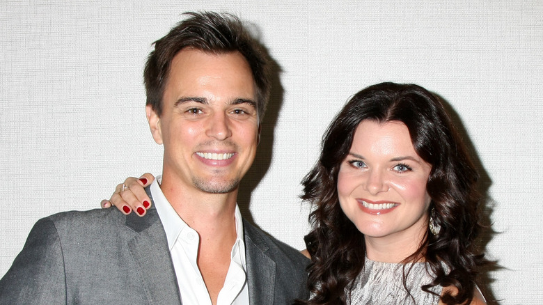 Darin Brooks and Heather Tom smiling