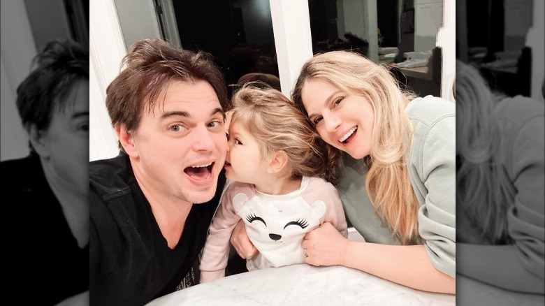 Brooks, Kruger, and daughter Everleigh