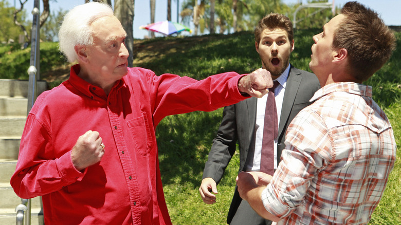 The Bold and the Beautiful's Wyatt being punched by Bob Barker as Liam looks shocked