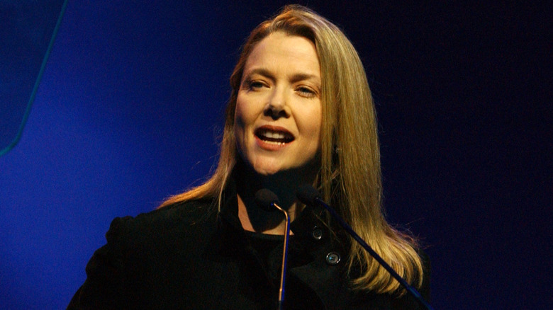Annette Bening with long straight hair speaking at the "Passport 2002" 20th Anniversary Gala