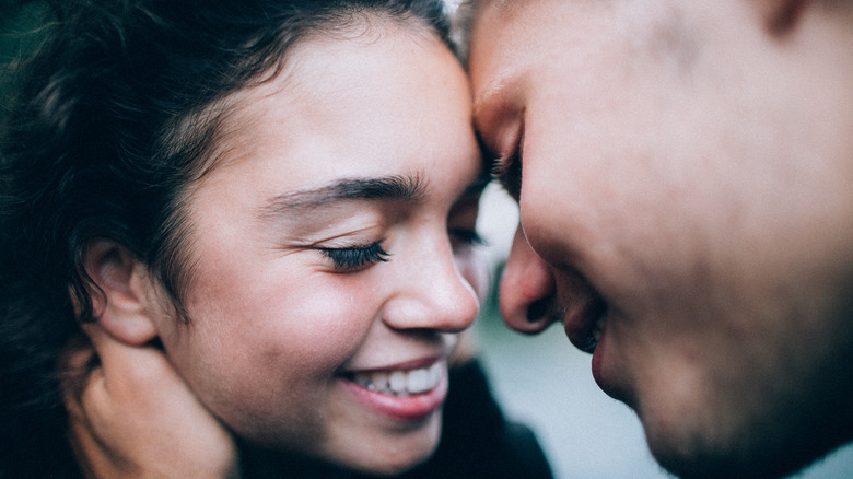 smiling couple about to kiss