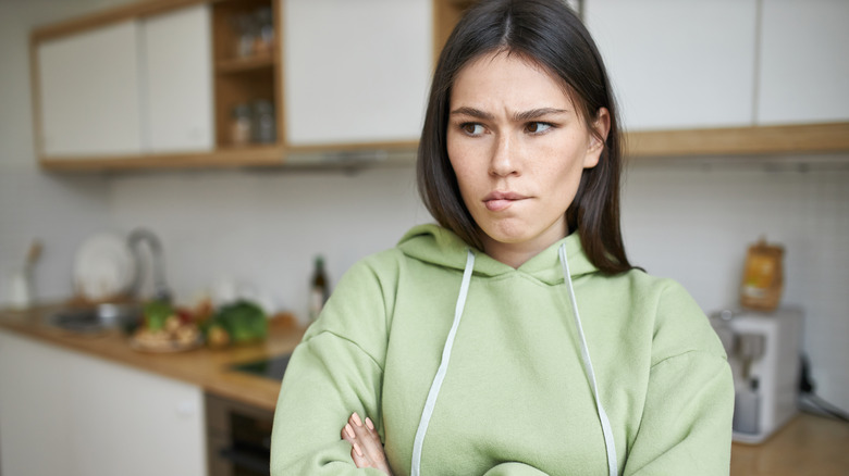 A woman frowning