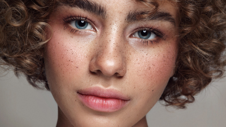 A woman showcasing sun-kissed cheeks