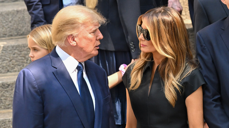 Donald Trump and Melania Trump looking at each other