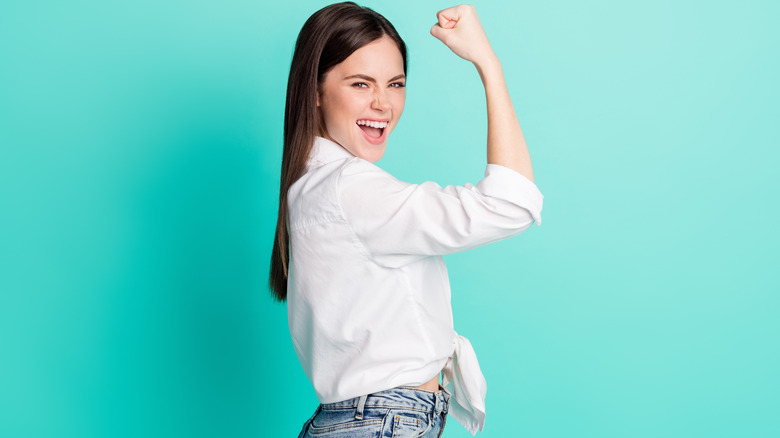 Woman wearing white tied button-down shirt