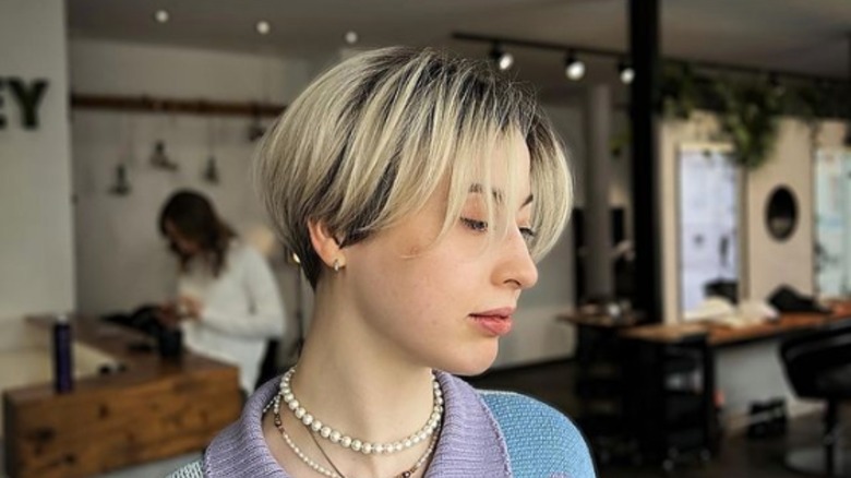 woman at hair salon with calligraphy cut