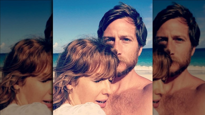 Kelly Reilly, her husband embracing
