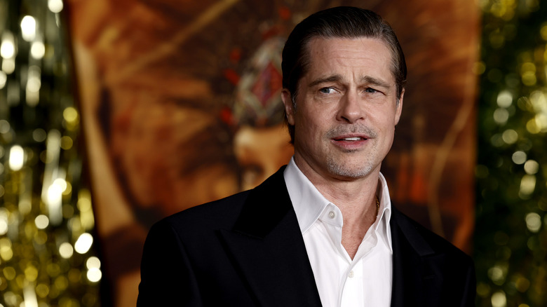 Brad Pitt looks to the side