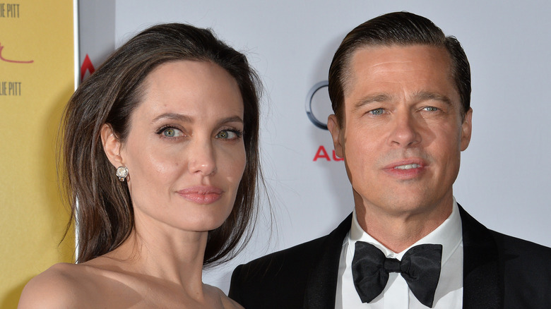 Angelina Jolie and Brad Pitt posing