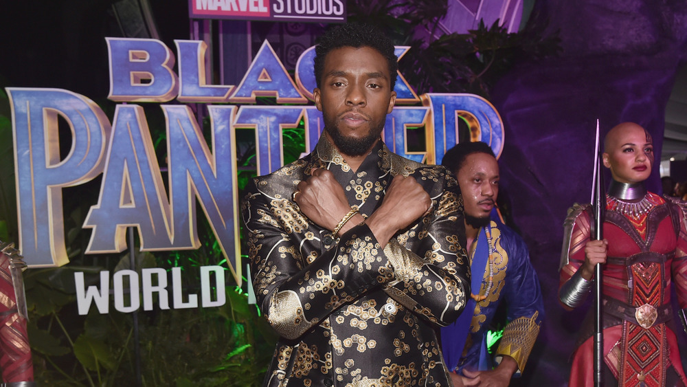 Chadwick Boseman giving Wakanda sign