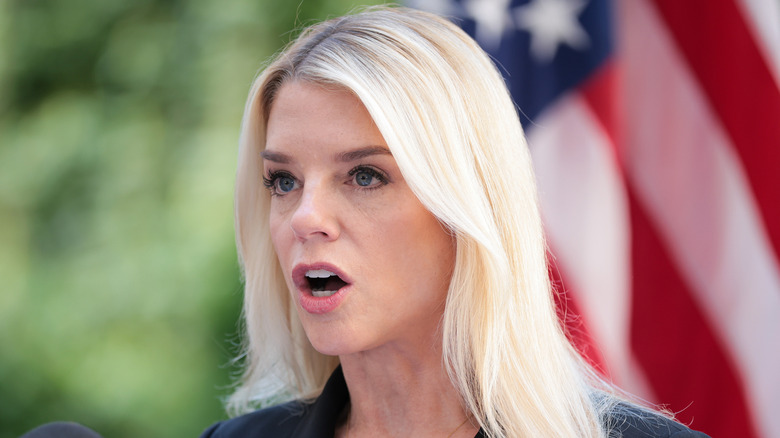 Pam Bondi speaks at a podium