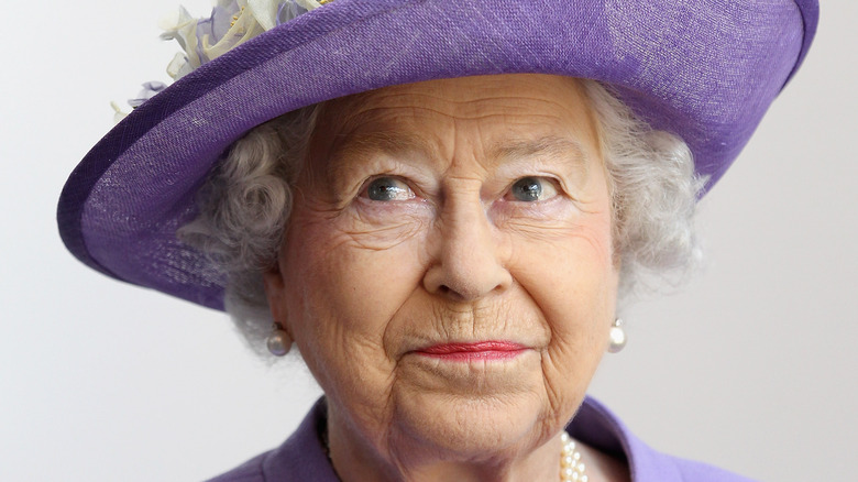 Queen Elizabeth in purple hat