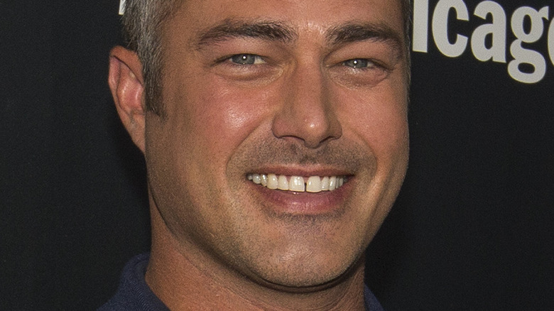 Taylor Kinney with wide smile