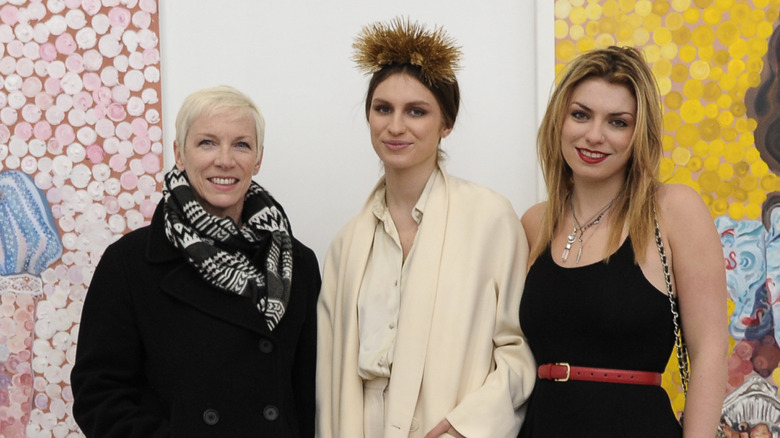 Annie Lennox posing with daughters Lola and Tali Lennox