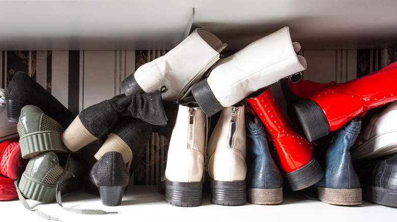 Boots and shoes in closet