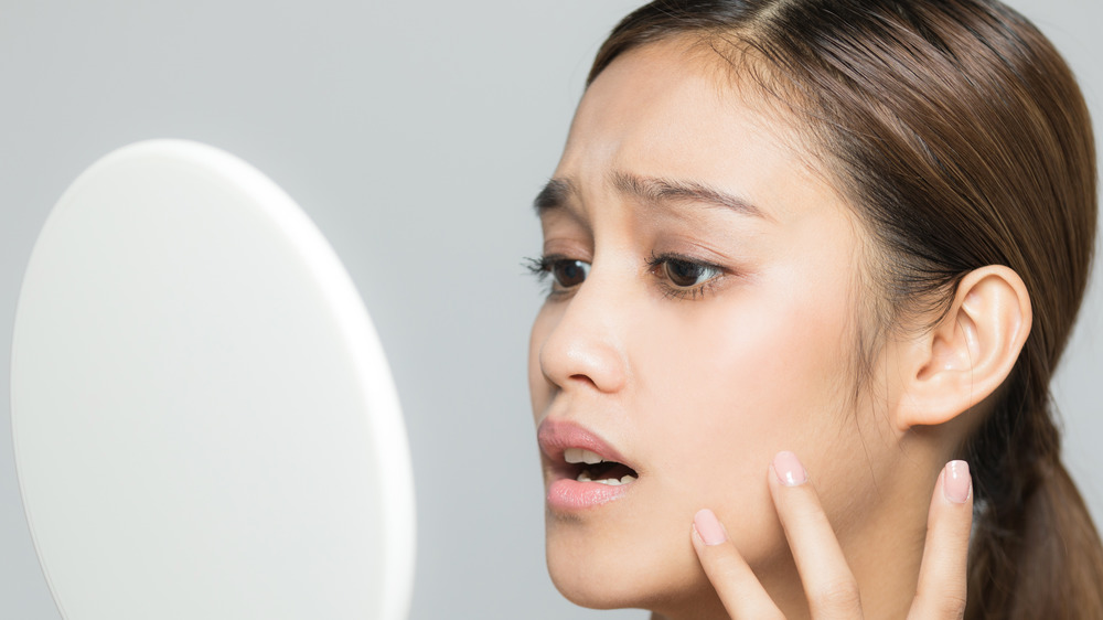 Woman looking in the mirror