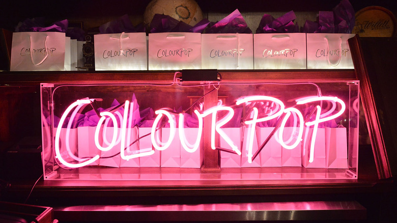 A neon pink ColourPop sign in 2015