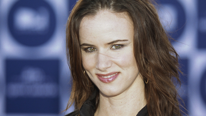 Young Juliette Lewis smiling