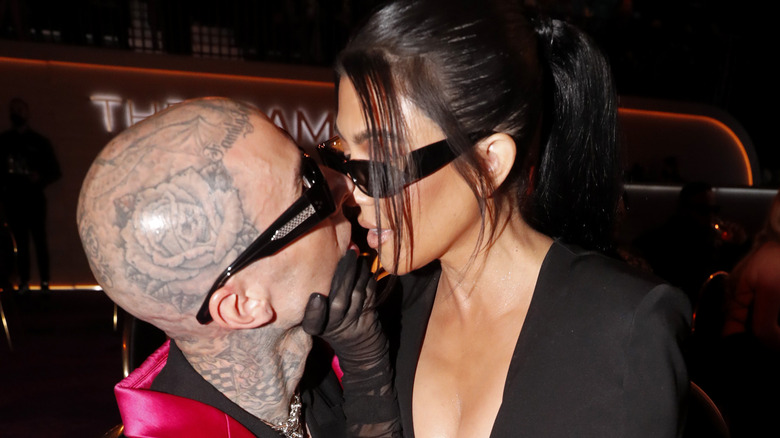 Travis Barker and Kourtney Kardashian kissing
