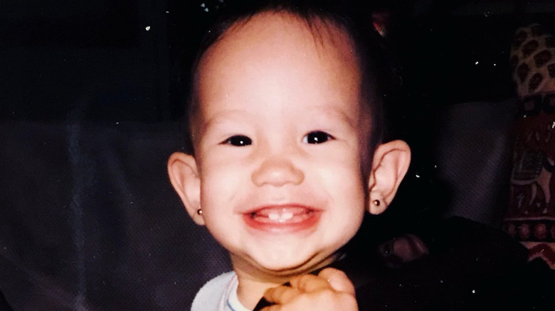 Cheryl Burke as a baby smiling