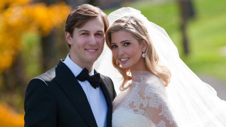 Jared Kushner and Ivanka Trump posing on their wedding day