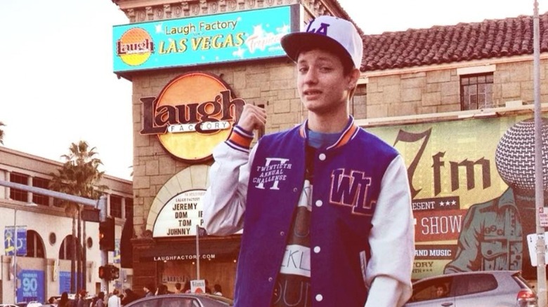 Teenage Matt Rife outside comedy club