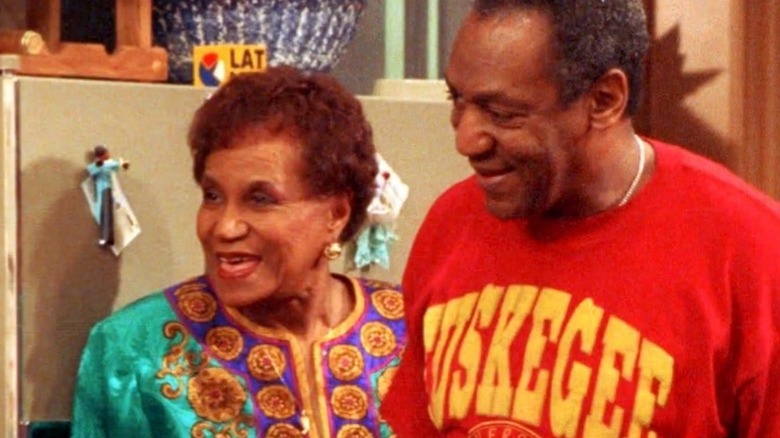 Clarice Taylor in yellow sweater and blue shirt on set of The Cosby Show