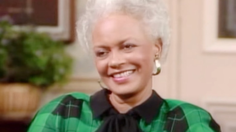 Ethel Ayler in green and black blouse on set of The Cosby Show