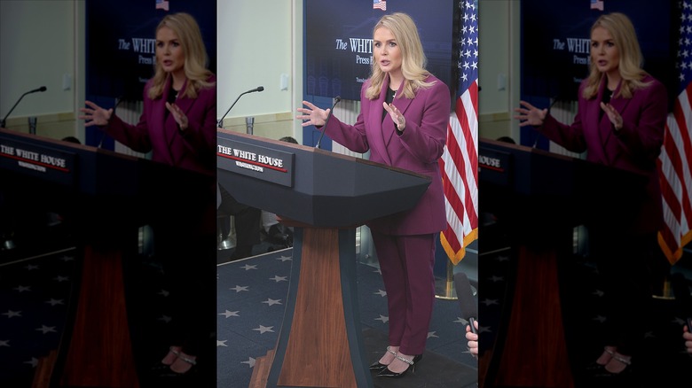 Karoline Leavitt wearing a purple suit at first press conference