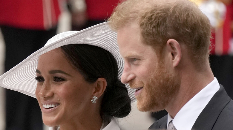 white hat wearing Meghan Markle and Prince Harry at St Paul's