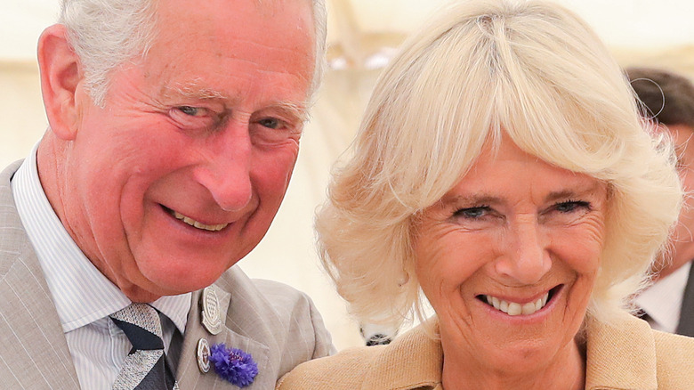 King Charles and Queen Camilla smiling