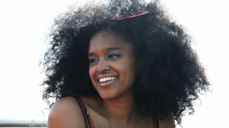 Smiling woman with curly hair