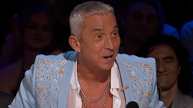 Bruno Tonioli speaking to contestants in a blue suit on "Dancing with the Stars"