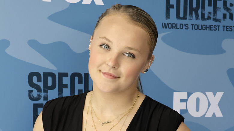 JoJo Siwa smiling with tilted head