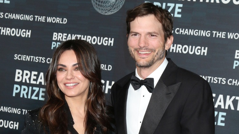 Mila Kunis and Ashton Kutcher at red carpet event 